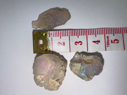 9 (3 opals, 28.20 cts total)