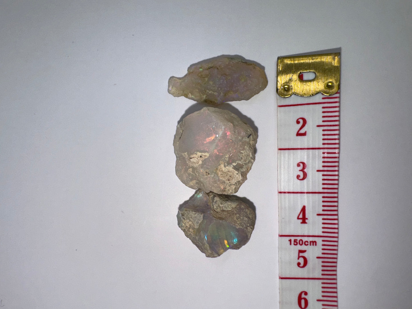 9 (3 opals, 28.20 cts total)